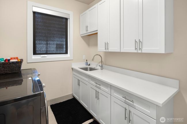 Laundry room upstairs serves your modern life with convenience and efficiency. | Image 26