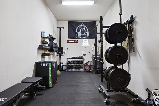 3rd car space in garage can be used for a home gym, work area, storage, or even a 3rd car. | Image 34