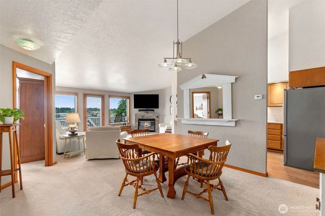 Spacious dining area is open to the living room and the view | Image 8