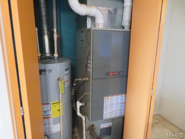 Utilities with heating unit and water heater | Image 11