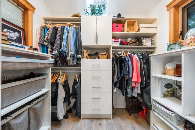 Walk in closet featuring light wood-style flooring | Image 17
