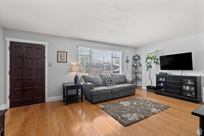 Living area featuring wood finished floors | Image 5