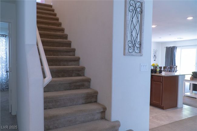 Stairway with tile patterned flooring and recessed lighting | Image 8