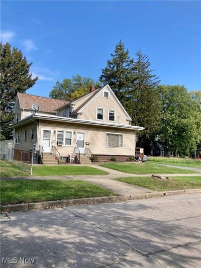 View of front of home featuring a front yard | Image 1