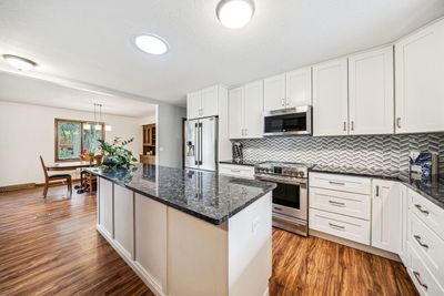 The home boasts a gorgeous new kitchen with large center island. | Image 2