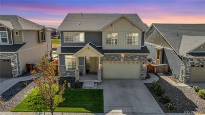 Beautifully landscaped, covered front porch and curb appeal. Sellers upgraded to add lights to either side of the garage. | Image 3