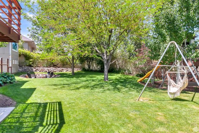 View of yard with a playground | Image 56