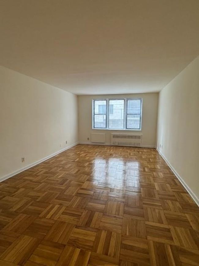 Empty room with radiator heating unit and baseboards | Image 6