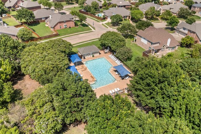 Aerial view of residential area featuring a pool area | Image 37
