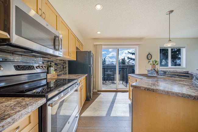 50 Panatella Park Nw, Home with 4 bedrooms, 2 bathrooms and 2 parking in Calgary AB | Image 6