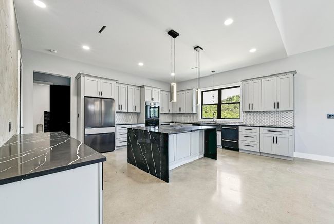 The stunning gourmet chef's kitchen is designed to make home cooking a breeze with state-of-the arts appliances and finishes to help you take your culinary art to the next level. | Image 13