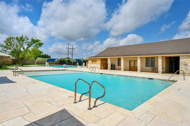 Community pool featuring a patio | Image 20
