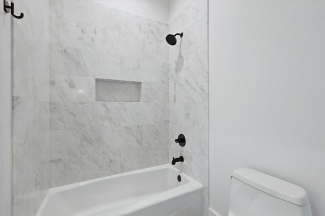 Full bathroom with toilet and washtub / shower combination | Image 31