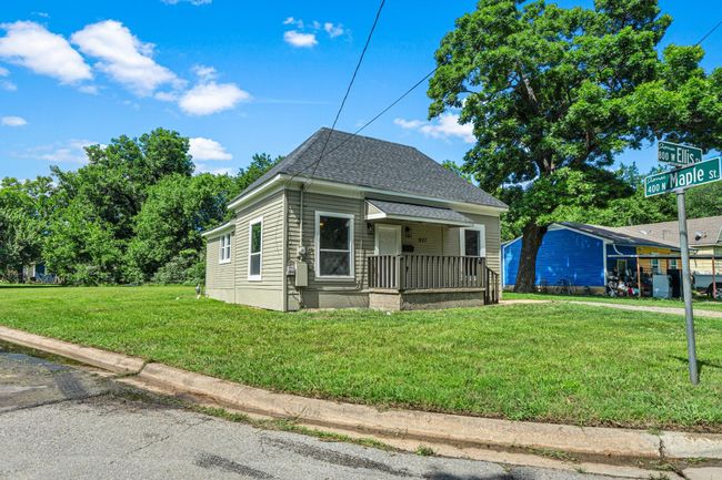 Bungalow-style home featuring a front lawn, a porch, and roof with shingles | Image 18