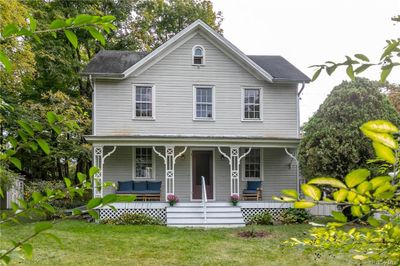 View of front of house with a front yard and a porch | Image 1