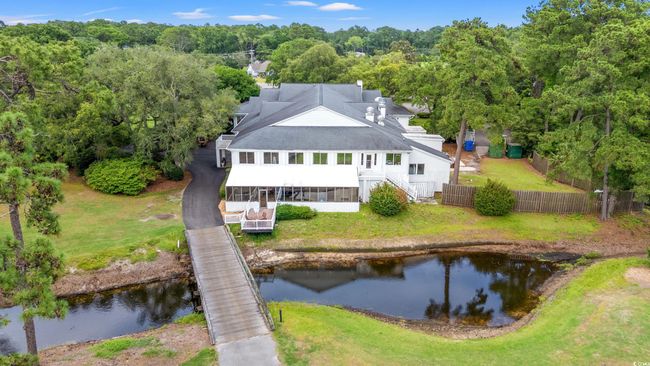 Aerial view of property and surrounding area featuring a nearby body of water | Image 37