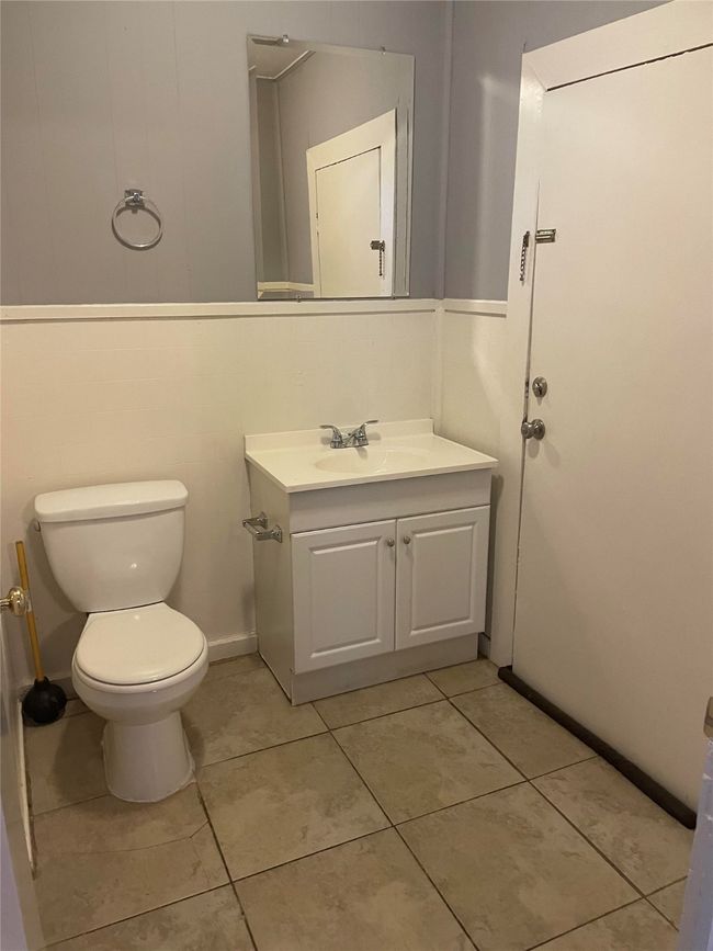 Half bath with vanity and tile patterned floors | Image 12