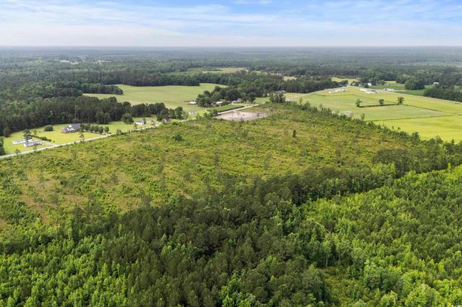 View of rural area featuring a heavily wooded area | Image 19
