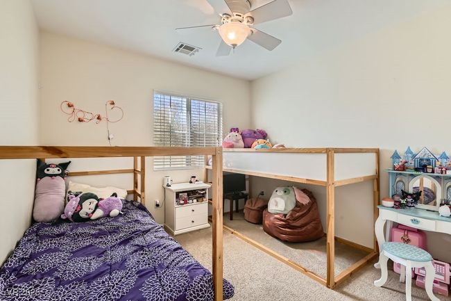 Bedroom featuring visible vents, carpet flooring, and a ceiling fan | Image 22