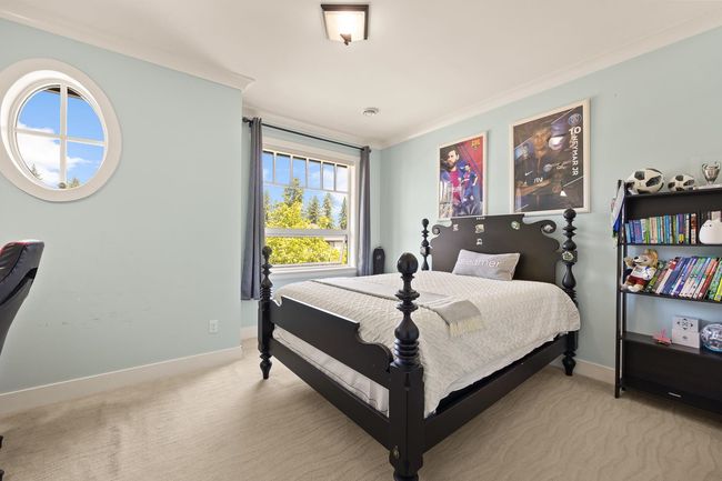 Bedroom featuring light colored carpet and ornamental molding | Image 18