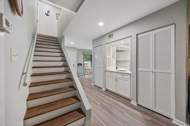 Stairway featuring wood finished floors and recessed lighting | Image 14