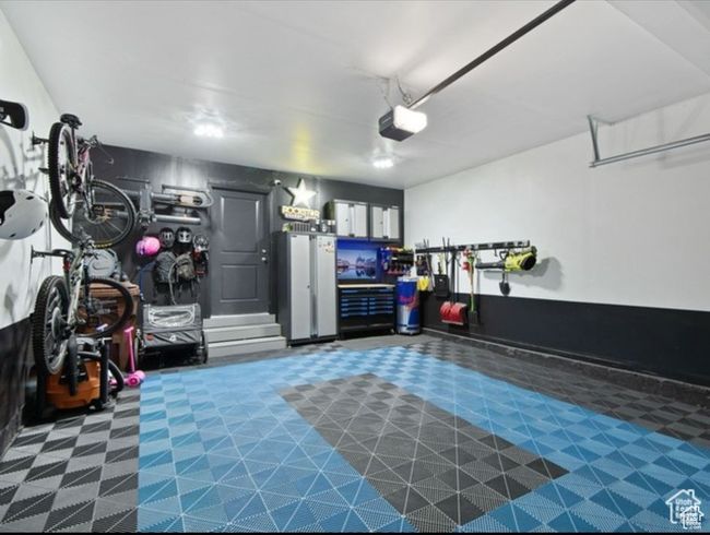 Garage with a garage door opener | Image 24