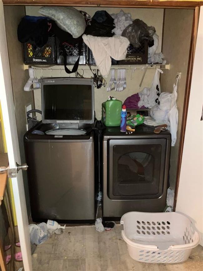 Laundry area with tile patterned flooring and washer and dryer | Image 14