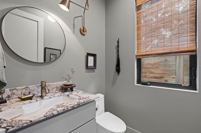 Bathroom featuring vanity and toilet | Image 22
