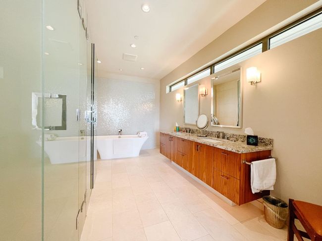 Full bath featuring a soaking tub, double vanity, a stall shower, and recessed lighting | Image 38