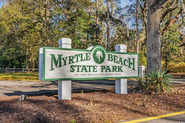 Community / neighborhood sign featuring view of scattered trees | Image 36
