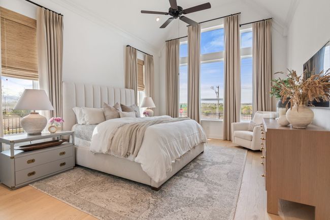 Bedroom featuring multiple windows, ornamental molding, light wood-style floors, a ceiling fan, and vaulted ceiling | Image 21