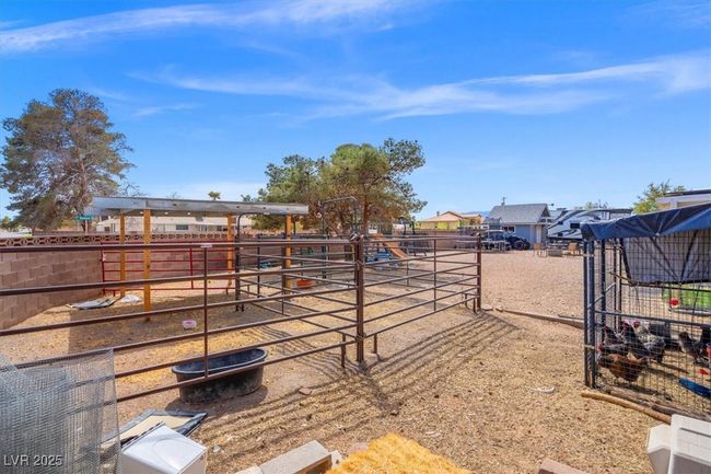 View of yard featuring an exterior structure and an outbuilding | Image 25