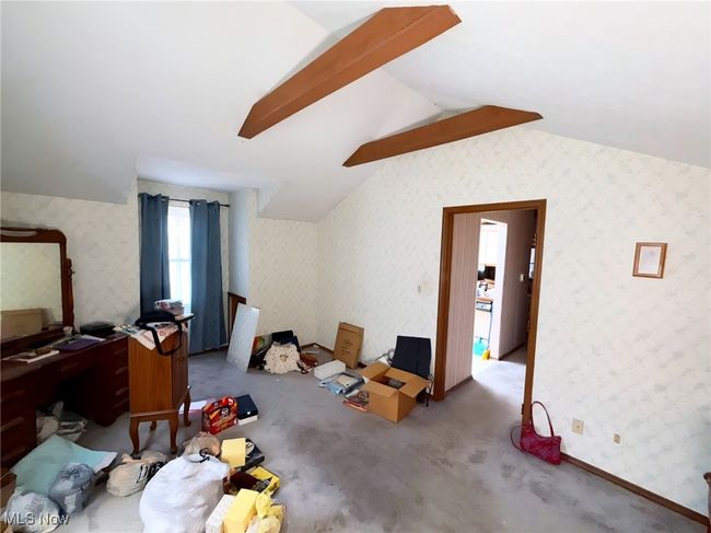 Bonus room with lofted ceiling, carpet floors, and wallpapered walls | Image 13