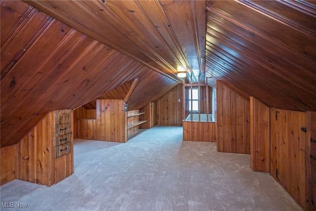Additional living space with wood walls, lofted ceiling, carpet flooring, and wooden ceiling | Image 27