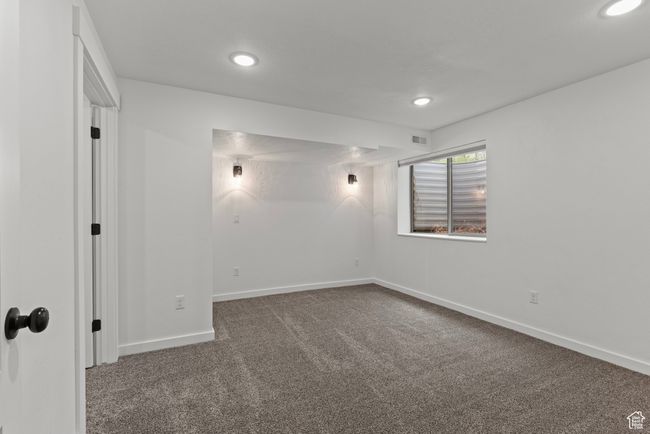 Carpeted spare room featuring recessed lighting and baseboards | Image 35