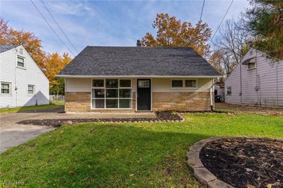 Bungalow-style house featuring a front yard | Image 1