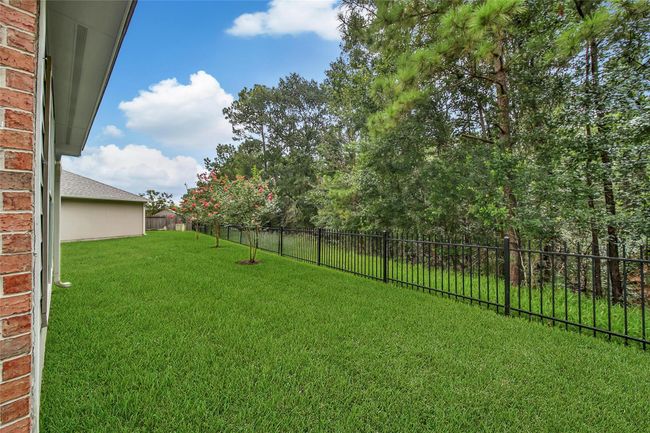 The wooded greenbelt provides privacy and keeps you close to nature with deer that will visit the greenbelt and plenty of other wildlife. | Image 27
