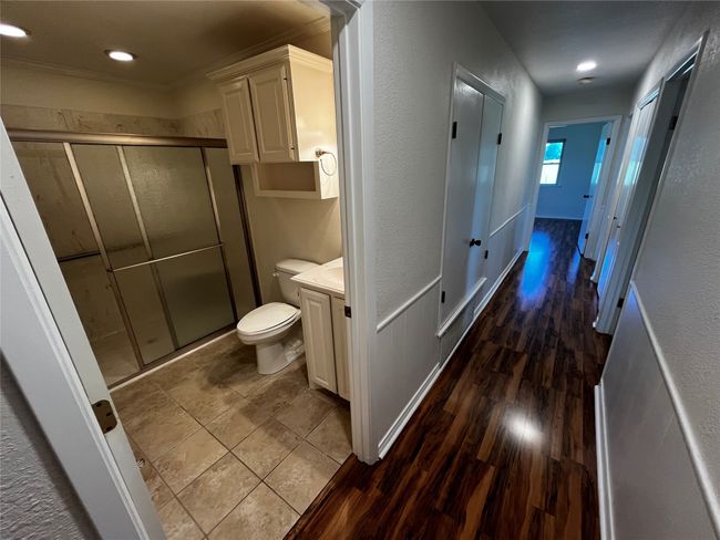 Spacious full bathroom in the hallway | Image 15