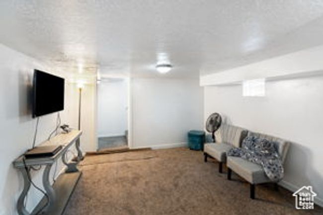 Sitting room with carpet flooring and baseboards | Image 27