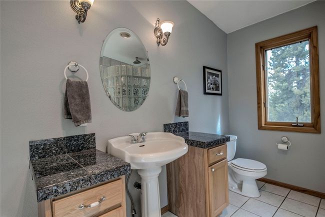Bathroom featuring tile patterned floors and two sinks | Image 33