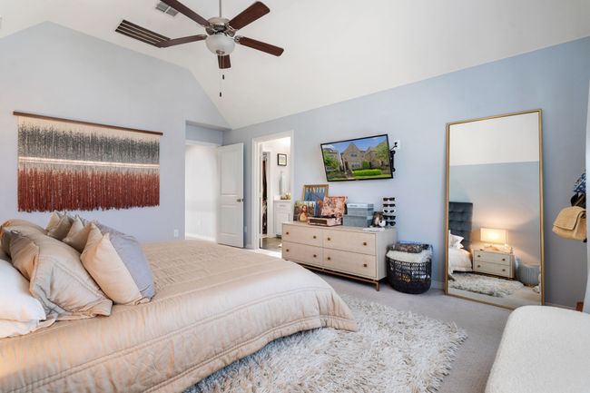 Bedroom featuring carpet floors, high vaulted ceiling, and a ceiling fan | Image 14