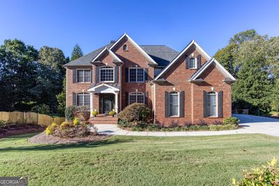 View of front of property featuring a front lawn &amp; side entry drive | Image 2