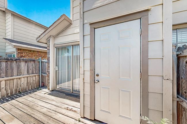 Doorway to property featuring a wooden deck | Image 31
