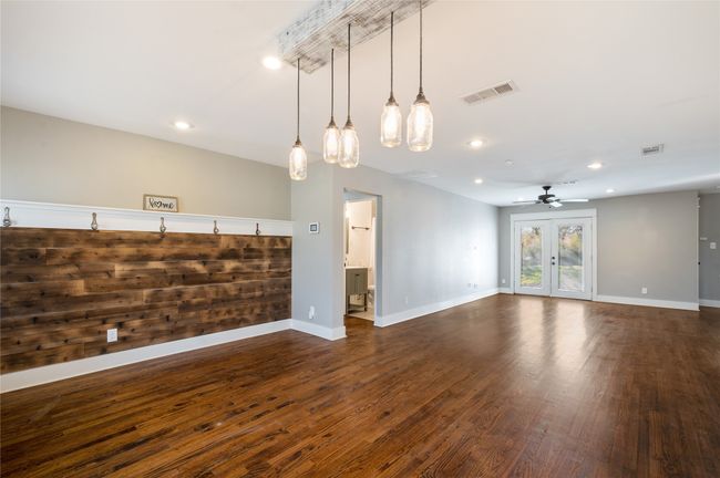 Dining area with unique lighting | Image 8