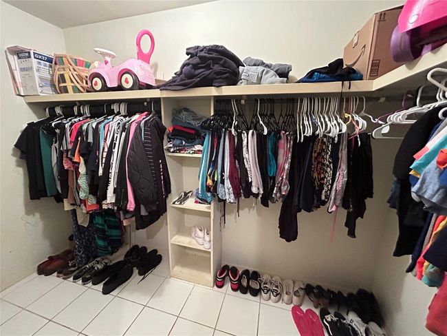 Walk in closet with tile patterned flooring | Image 12