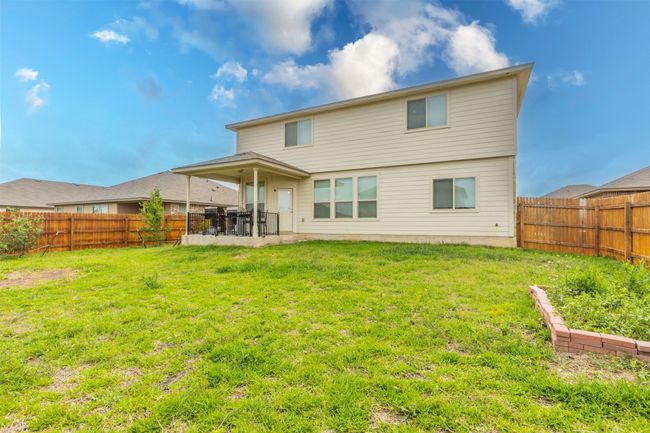 Back of property with a yard, a patio, and a fenced backyard | Image 34