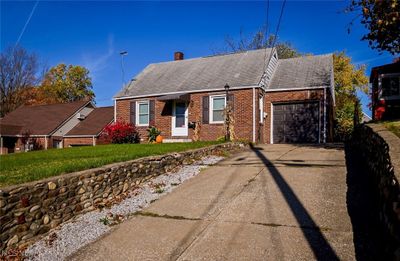 View of front facade featuring a garage | Image 2