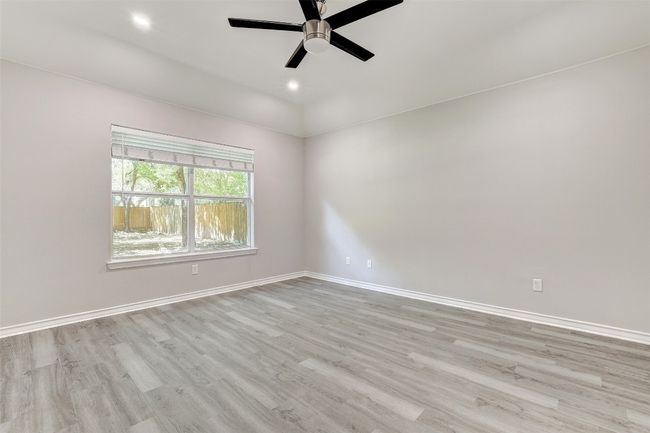 Primary bedroom with new ceiling fan | Image 19