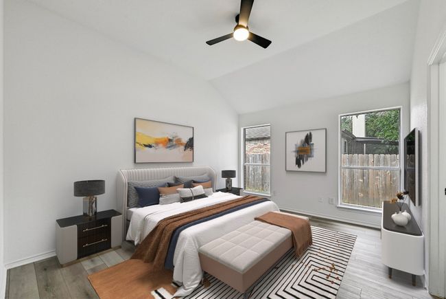 Bedroom with vaulted ceiling, light wood-style floors, and ceiling fan | Image 16