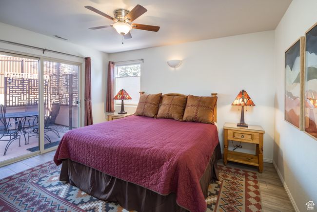 Bedroom with access to exterior, ceiling fan, and wood-type flooring | Image 20